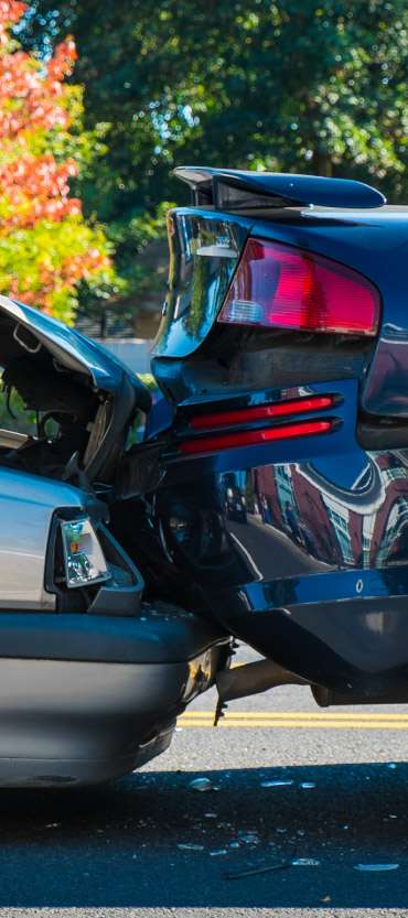 Close up image of a collision between two car bumpers