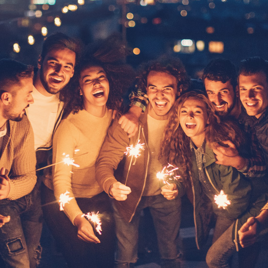 Groups of friends holding sparklers