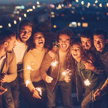 Image of a group of adults holding sparklers