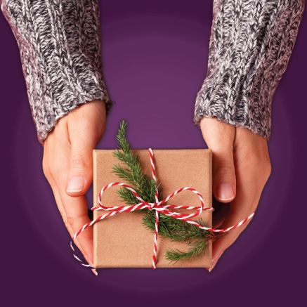 Image of two hands holding a present
