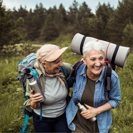 Two mature women hiking outdoors