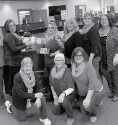 A group image of team members inside the Munising location