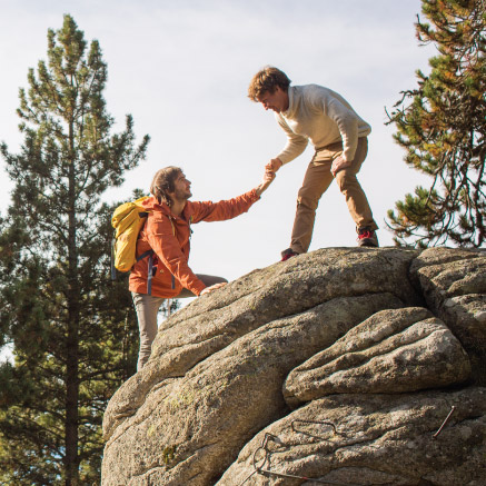 Two people climbing moutain