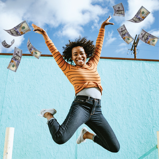 Person jumping and throwing money