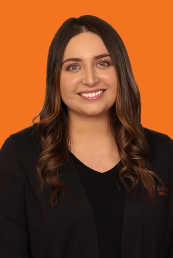 Ashley headshot on orange