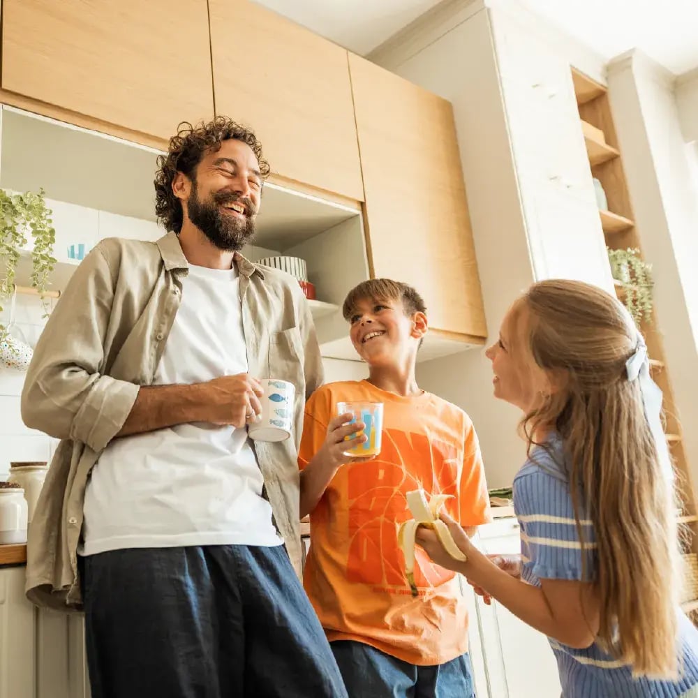 Dad & Kids smiling in the kitchen