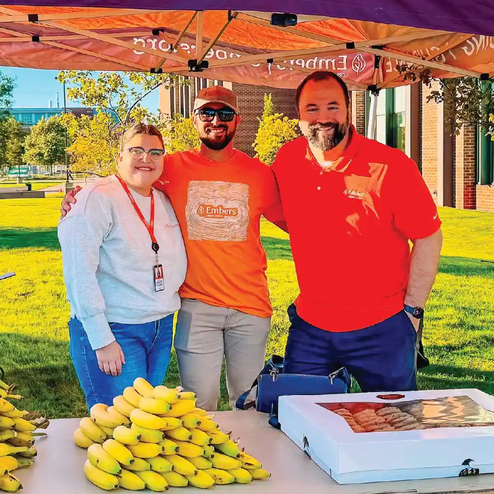 Embers Team Members passing out bananas at race
