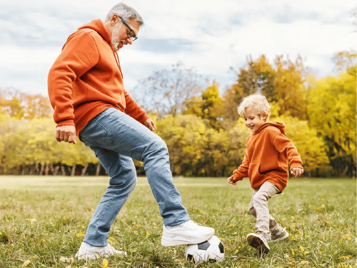 Grandparent Plaing Soccer with grandchild