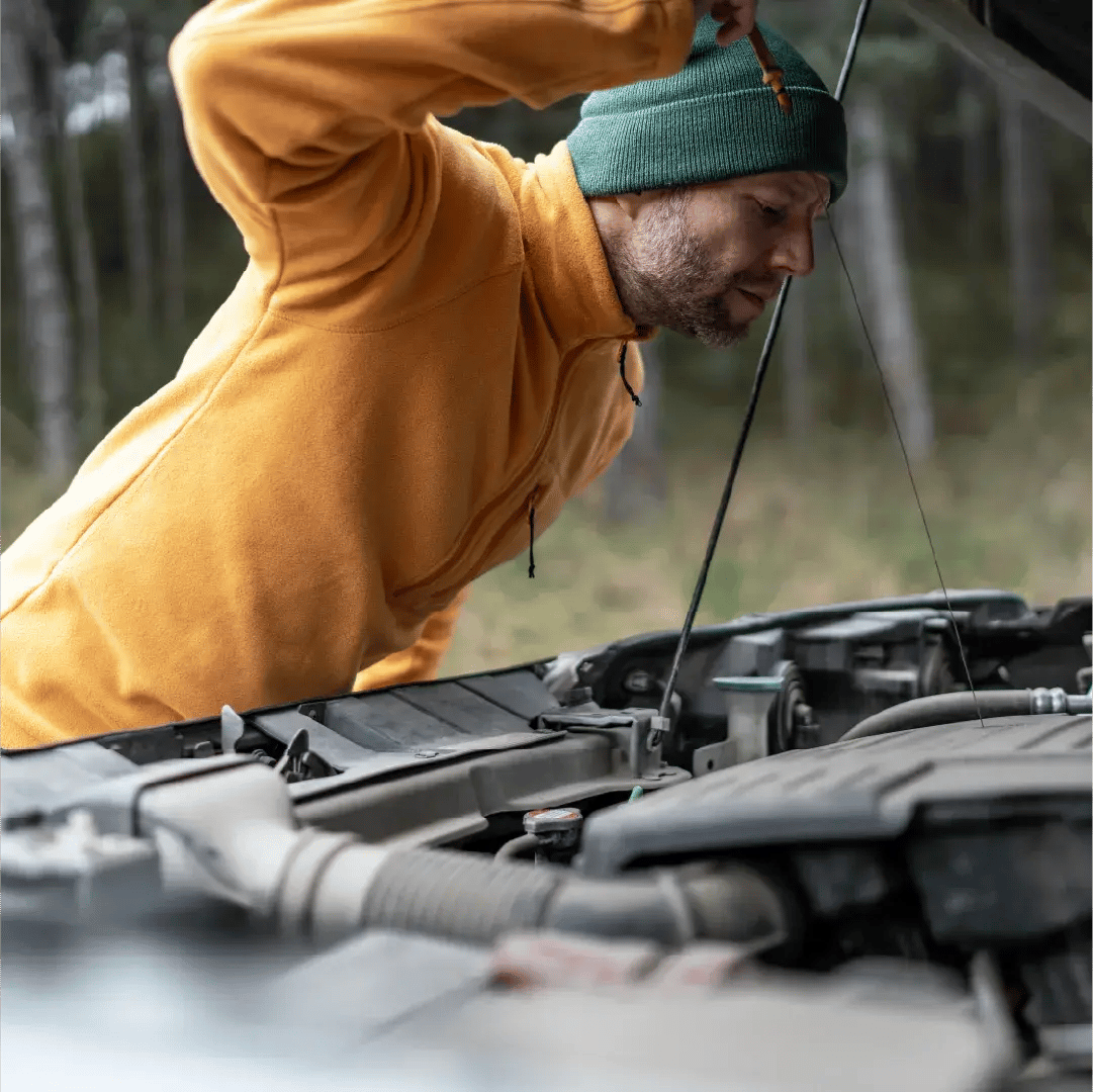 Man inspecting under hood of car1