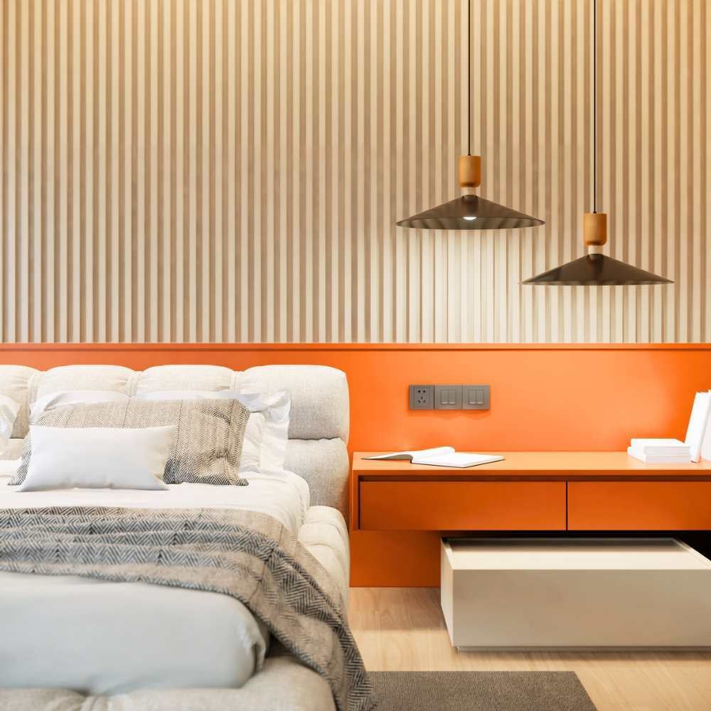 Modern bedroom with orange walls