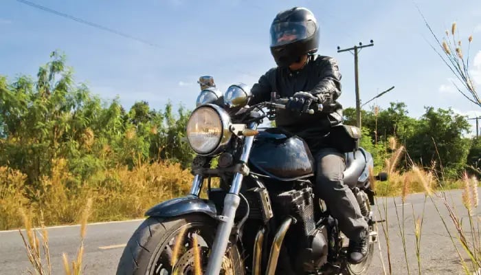 Motorcyclist on country road