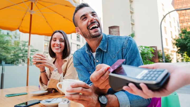 Person using card at restaurant-cafe