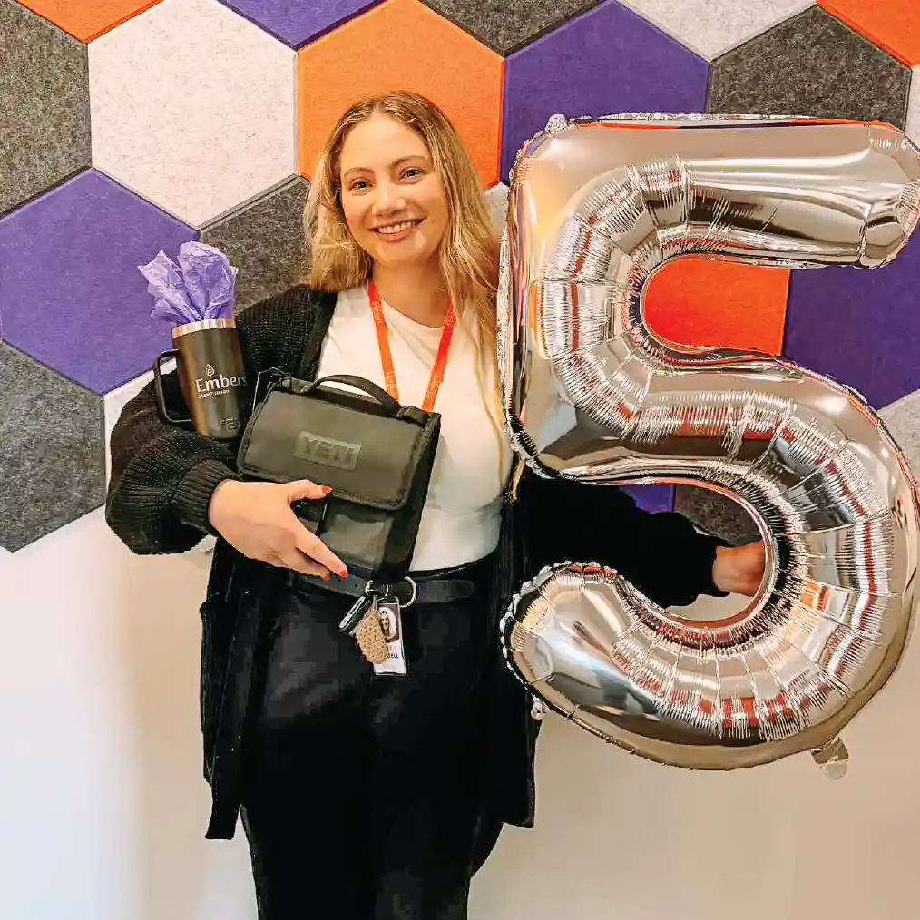 Embers Team Member celebrating Emberversary